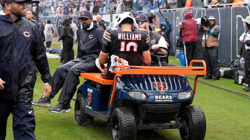 CHICAGO, ILLINOIS – SEPTEMBER 20: Caleb Williams #18 of the Chicago Bears is carted off the field after an injury against the Minnesota Vikings during the third quarter of the game at Soldier Field on September 20, 2026 in Chicago, Illinois. (Photo by Patrick McDermott/Getty Images)