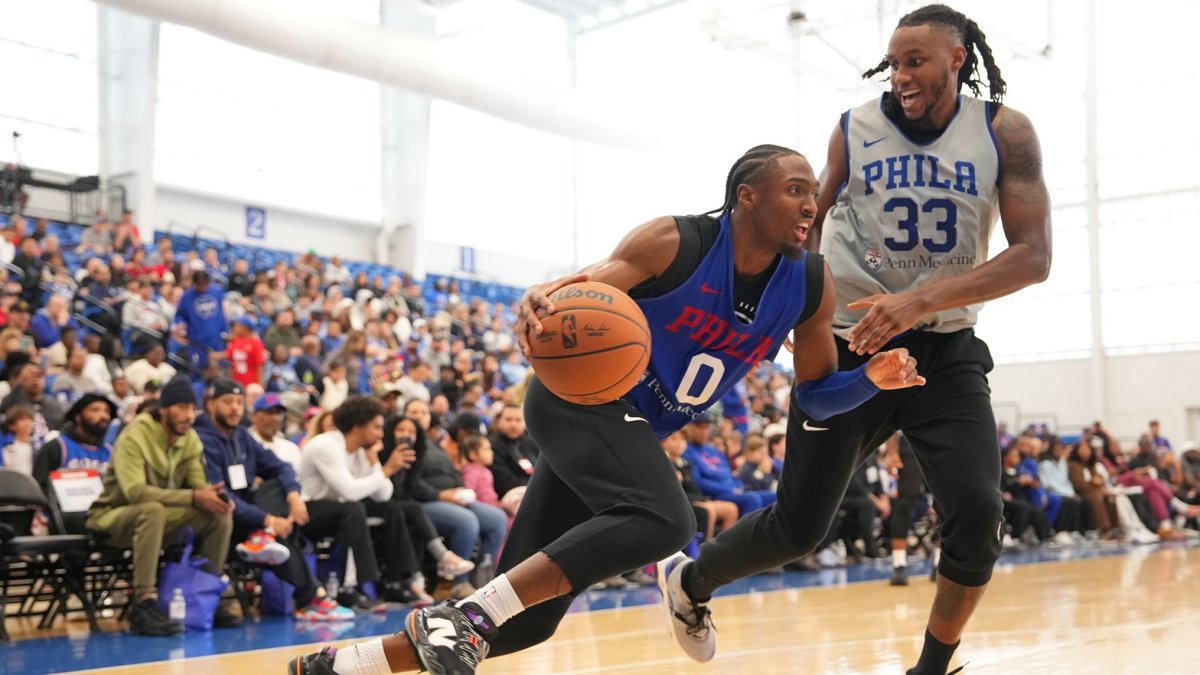 Tyrese Maxey drives against Jabari Walker in a 2026 Sixers scrimmage