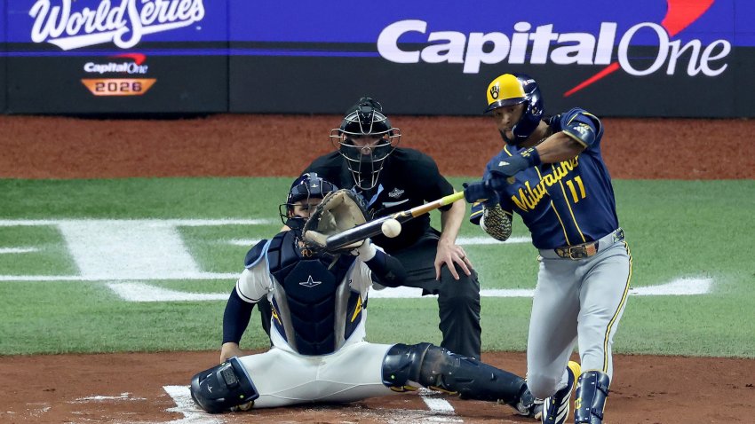 Jackson Chourio #11 of the Milwaukee Brewers hits a single.